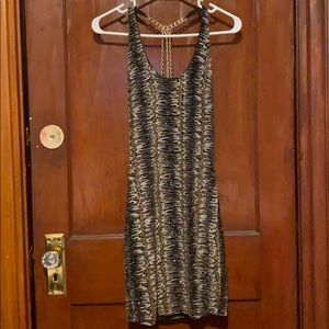 It’s a beautiful elegant shiny Mini dress .